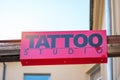 TATTOO STUDIO sign on city street Royalty Free Stock Photo