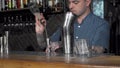 Tattooed bartender preparing cocktail at the bar Royalty Free Stock Photo