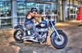 Tattooed biker on Harley Davidson motorbike