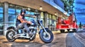 Tattooed biker on Harley Davidson motorbike