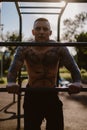 Tattooed fighter resting in a outdoor gym