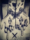 Tattooed hands and the numbers 1969