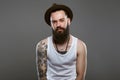 Tattooed handsome Bearded Man in Hat.