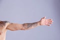 Tattooed man on grey background Royalty Free Stock Photo