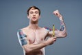 tattooed man muscular bodybuilder Fitness gray background Royalty Free Stock Photo