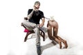 Tattooed rap singer posing in studio with a female dummy Royalty Free Stock Photo