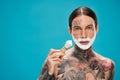 tattooed and shirtless man with shaving Royalty Free Stock Photo