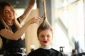 Tattooed Stylist Cutting Hair of Closed Eyes Woman Royalty Free Stock Photo