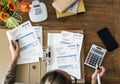 Tattooed Woman doing accounting work