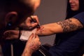 Tattooer makes scetch Royalty Free Stock Photo