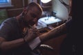 Tattooer makes scetch Royalty Free Stock Photo