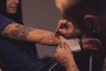 Tattooer makes scetch Royalty Free Stock Photo