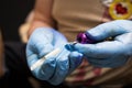 Tattooer showing process of making a tattoo, hands holding a tatoo machine Royalty Free Stock Photo