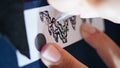 Tattooist hands transferring sketch at table closeup. Woman fingers drawing pen