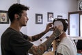 Tattooist placing the drawing on the head