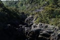 tourists gather on Aratiatia lookout to watch the river swell over rapids when dam gate