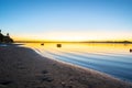 Tauranga harbour sunrise with blues and golden hues