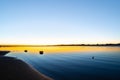 Tauranga harbour sunrise with blues and golden hues