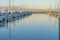 Tauranga Marina Boats And Piers Reflected In Calm Water At Sunrise