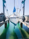 Tauranga Marina hardstand travel lift with yacht hoisted for mai