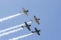 Tauranga New Zealand - February 7 2010; Going up, Squadron or fleet of aerobatics planes with contrails against blue sky