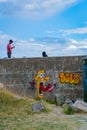 Fishing off old concrete wall on Moturiki Island