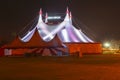 Circus tent illuminated from inside at night