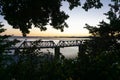 Tauranga`s historic Railway Bridge framed by leafy trees at end Elizabeth Street