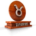 Taurus zodiac sign. 3D illustration of the zodiac sign Taurus made of stone on a wooden stand with the name of the sign at the bas Royalty Free Stock Photo