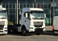 Brand new Man semi truck showing in front of the official dealership of the german manufacturer of commercial vehicles.