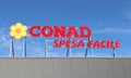 Conad Spesa Facile logo and brand name on store facade.