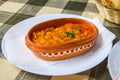 Tavche gravche (baked beans) - traditional Macedonian dish on table Royalty Free Stock Photo