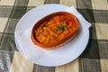 Tavche gravche (baked beans) - traditional Macedonian dish on table Royalty Free Stock Photo