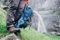 Taveler legs in wet outoor shoes hear the Jogini waterfall