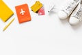 Tavelling background - airplane, shoes, notebook, passport - on white table from above copy space Royalty Free Stock Photo
