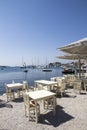Taverna tables looking over Skiathos old harbour, Skiathos Town, Greece, August 18, 2017 Royalty Free Stock Photo