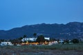 Taverns on the street of a coastal town in the evening