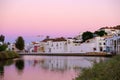 TAVIRA, ALGARVE, PORTUGAL - MAI 25, 2019: View on the iron bridge in Tavira and the river Gilao Royalty Free Stock Photo