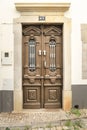 Old wooden door with wrought iron door knockers Royalty Free Stock Photo