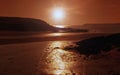 Tawny Sunset, across the beach and sea from Angle