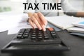 Tax accountant working with calculator and documents at table Royalty Free Stock Photo