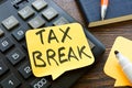 Tax break memo on the calculator and pen. Royalty Free Stock Photo