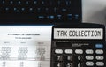 Tax collection - concept of text on calculator display. Top view Royalty Free Stock Photo