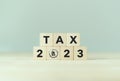 TAX in 2023 concept, on wooden block. State taxes,tax payment, governant ,calculating finance, tax accounting