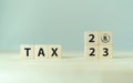 TAX in 2023 concept, on wooden block. State taxes,tax payment, governant ,calculating finance, tax accounting.