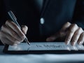 Tax consultant reviews tax return details on tablet. Expert uses digital pen. Close-up view of tech tools for tax calculation.