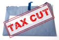 Tax cut concept, text design `Tax cut`  blue envelope of tax form as the background. Royalty Free Stock Photo