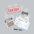 Tax day with calculator, envelope, pen and glasses