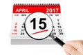 Tax Day Concept. 15 april 2017 calendar with magnifier