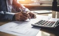 Tax day poster. Man sitting at wooden office table, holding pen, filling in forms and calculating taxes. AI Generative Royalty Free Stock Photo